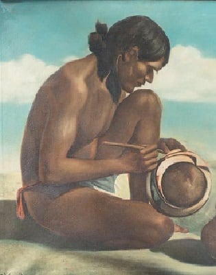 Pueblo Indian making pottery